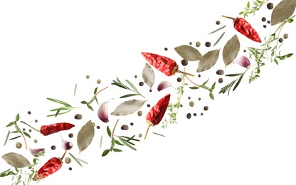 Image of Many different spices flying on white background