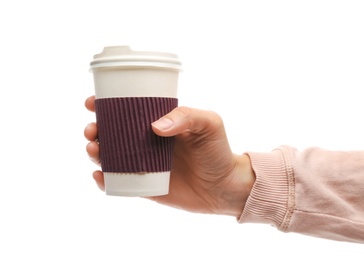 Woman holding takeaway paper coffee cup with cardboard sleeve on white background