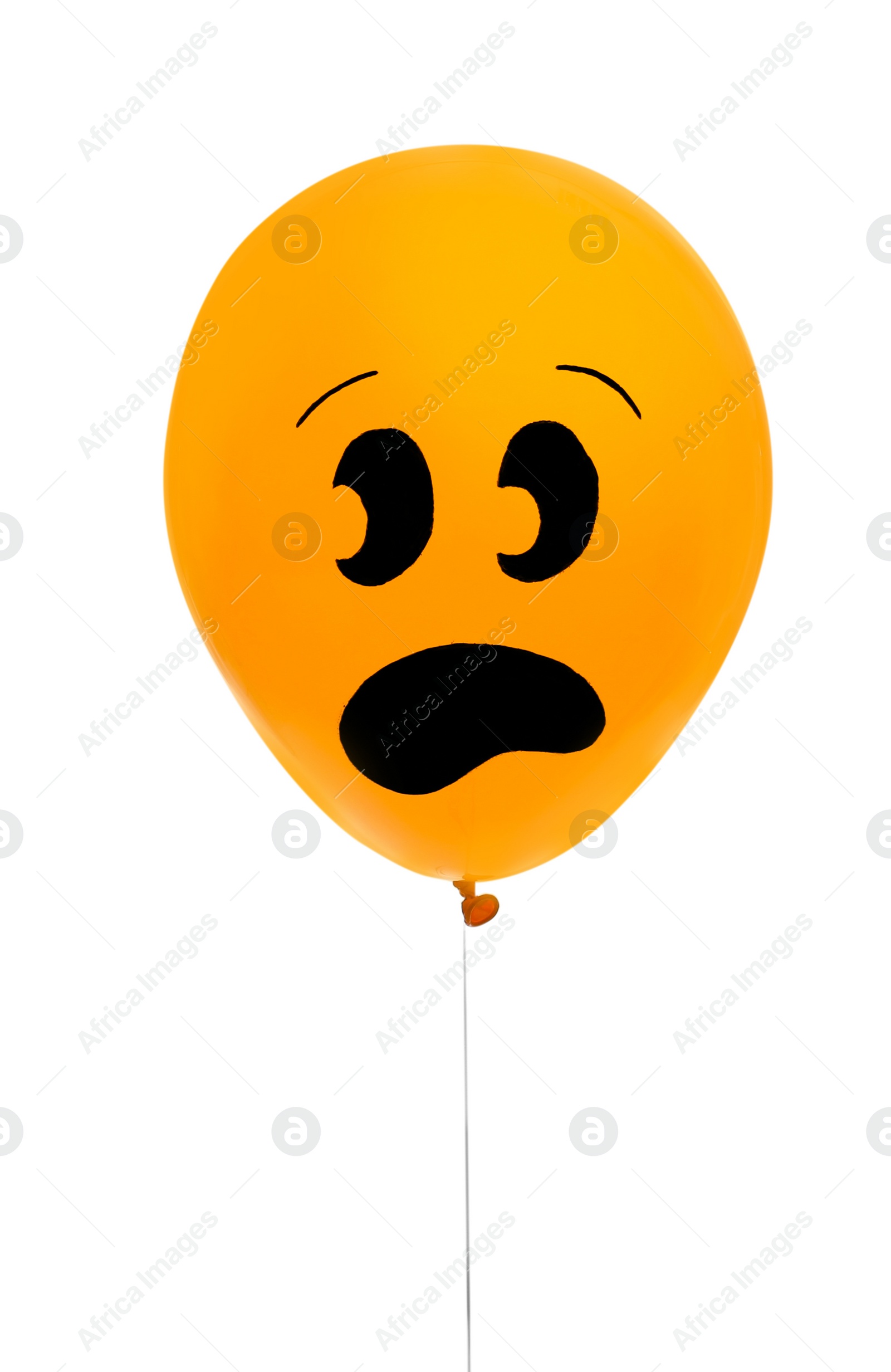 Photo of Orange balloon with drawing of scared face on white background. Halloween party