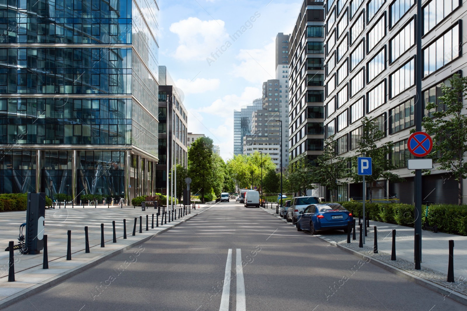 Photo of Road between beautiful buildings with many windows in city