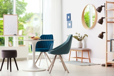 Modern dining room interior with table and chairs