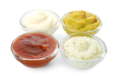 Many different sauces in bowls on white background