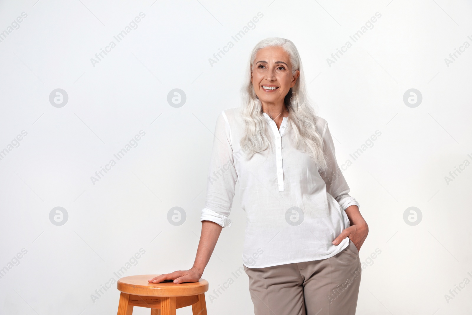 Photo of Portrait of beautiful mature woman on light background