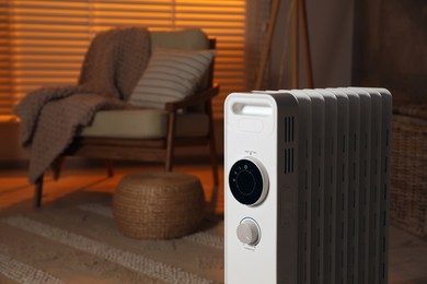 Photo of Modern portable electric heater indoors, space for text