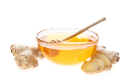 Photo of Ginger and honey on white background. Natural cold remedies