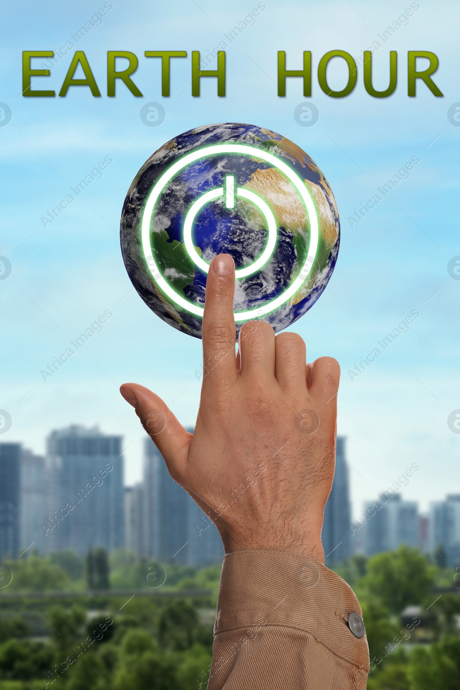 Image of Turn off lights for Earth hour. Man pressing button on globe outdoors, closeup