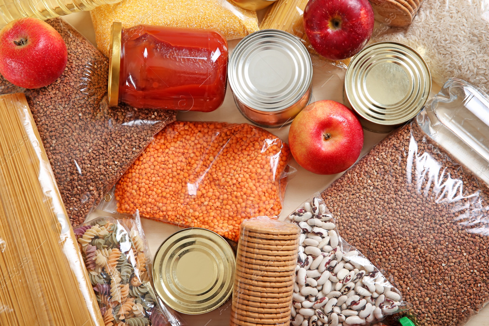 Photo of Many different products on table, top view. Food donation