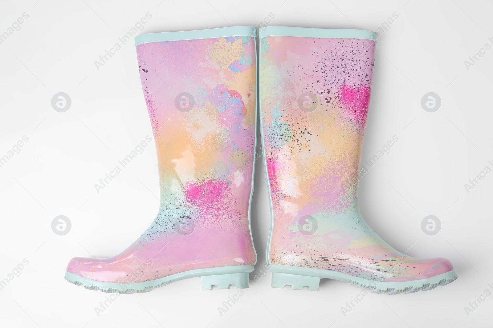 Photo of Pair of gumboots on white background, top view. Female shoes