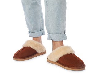 Photo of Woman in soft slippers on white background, closeup