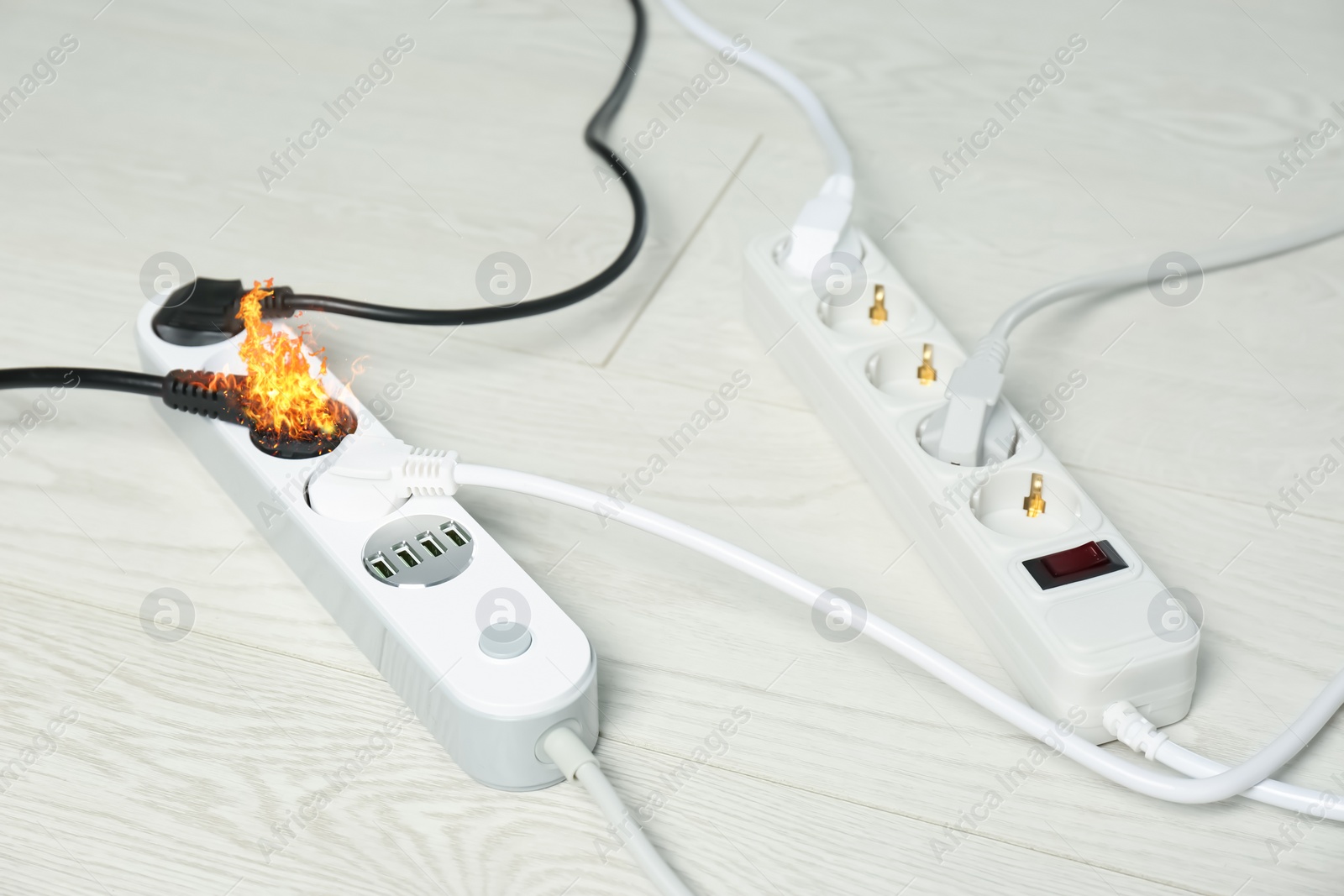 Image of Inflamed plug in power board - result of electrical short circuit