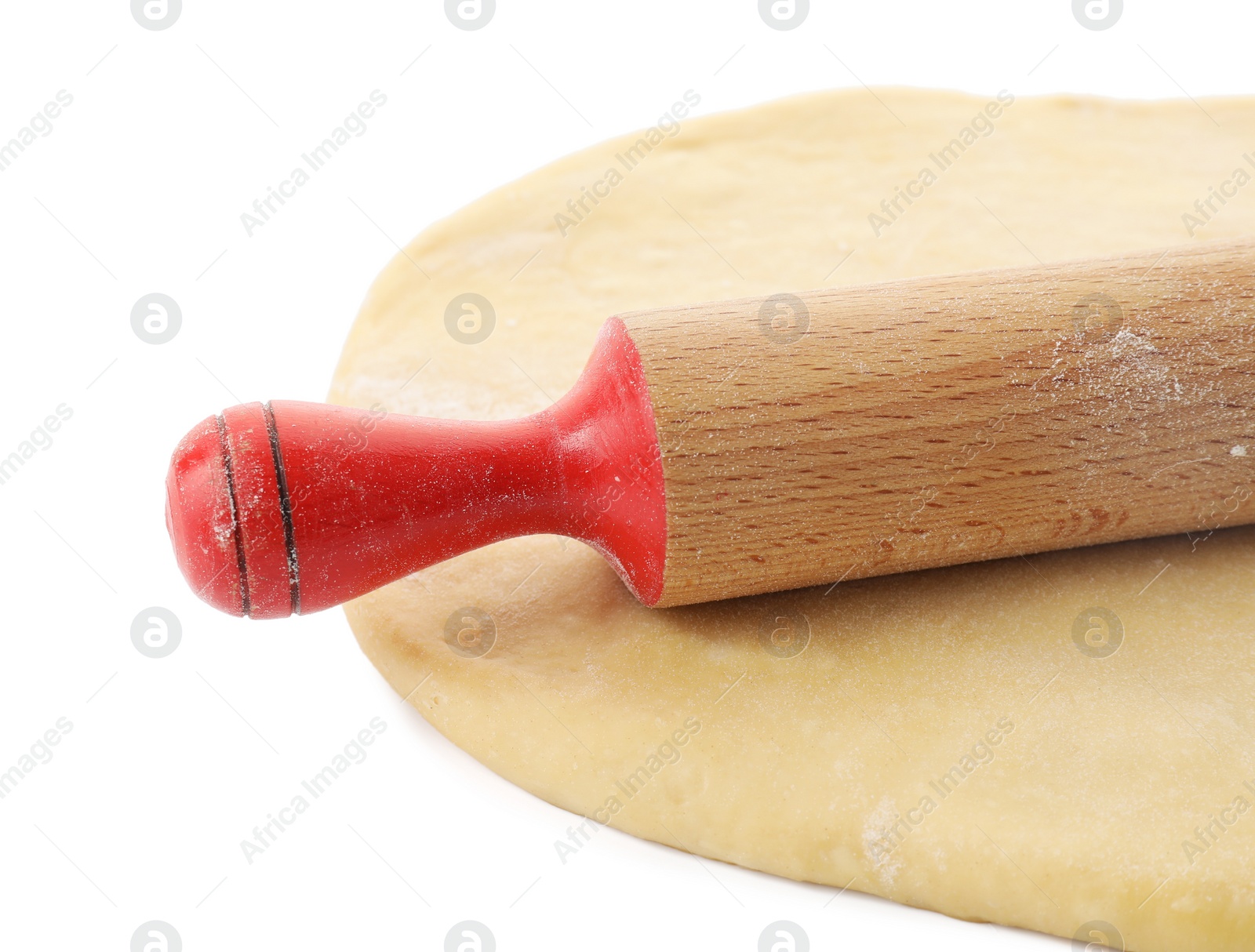 Photo of Raw dough and rolling pin isolated on white