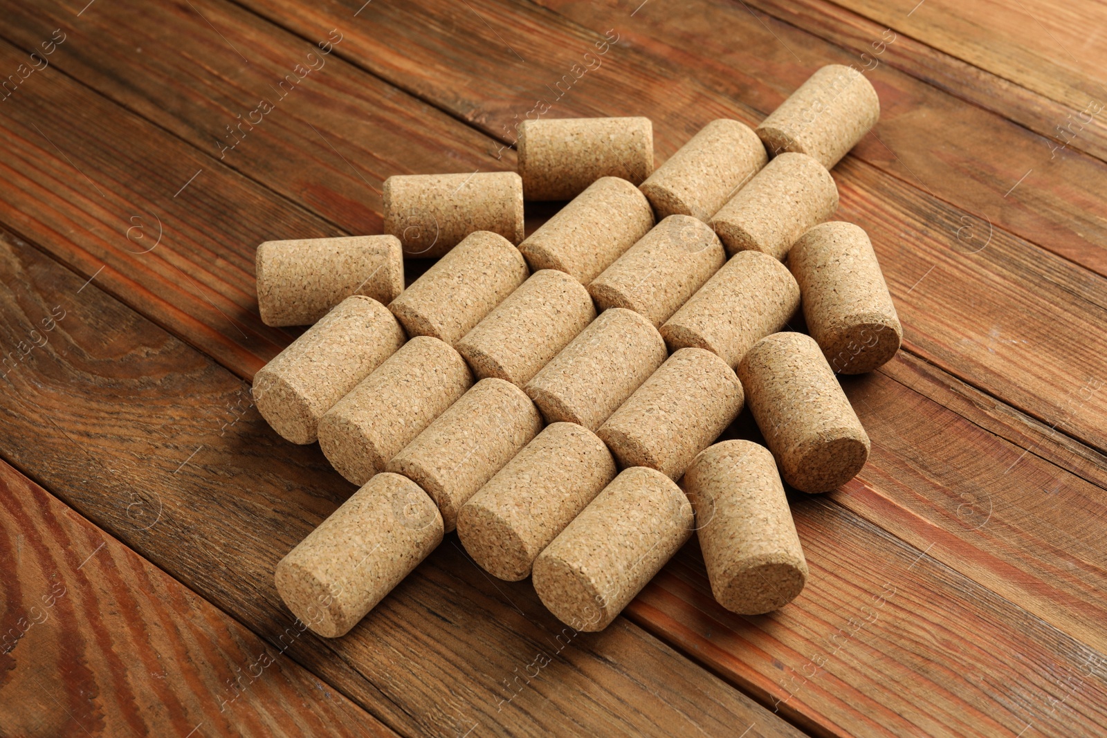 Photo of Christmas tree made of wine corks on wooden table