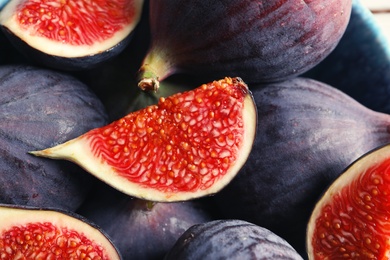 Photo of Bowl with fresh ripe figs, closeup. Tropical fruit