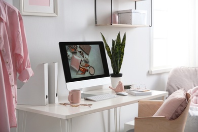 Comfortable workplace with computer on desk in home office