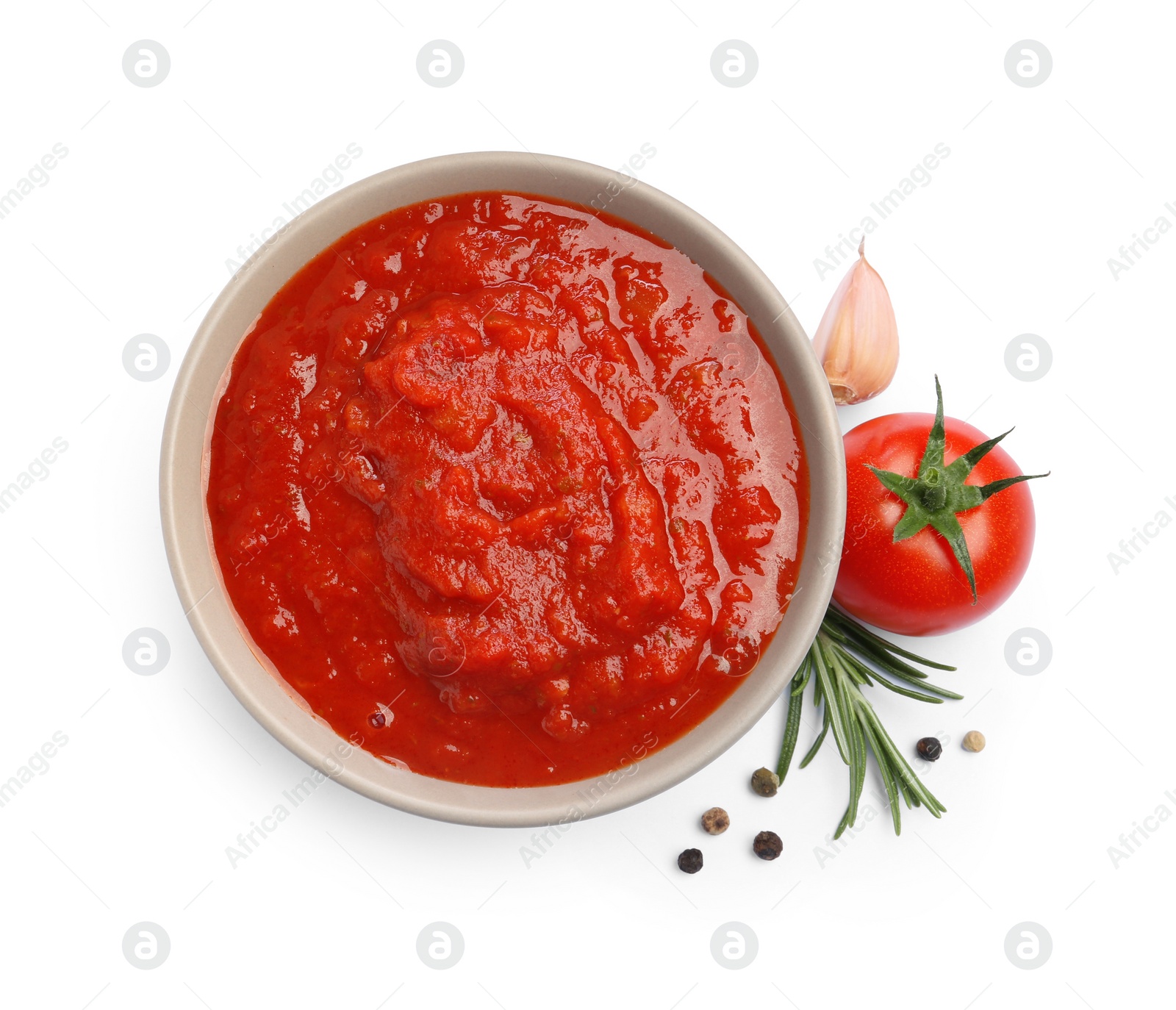 Photo of Homemade tomato sauce in bowl and fresh ingredients isolated on white, top view