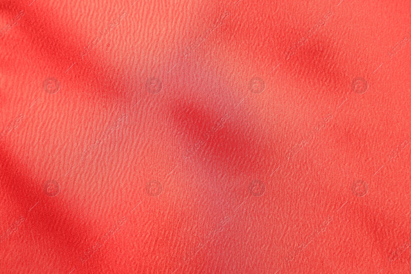 Photo of Texture of red fabric as background, top view