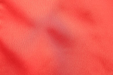 Photo of Texture of red fabric as background, top view