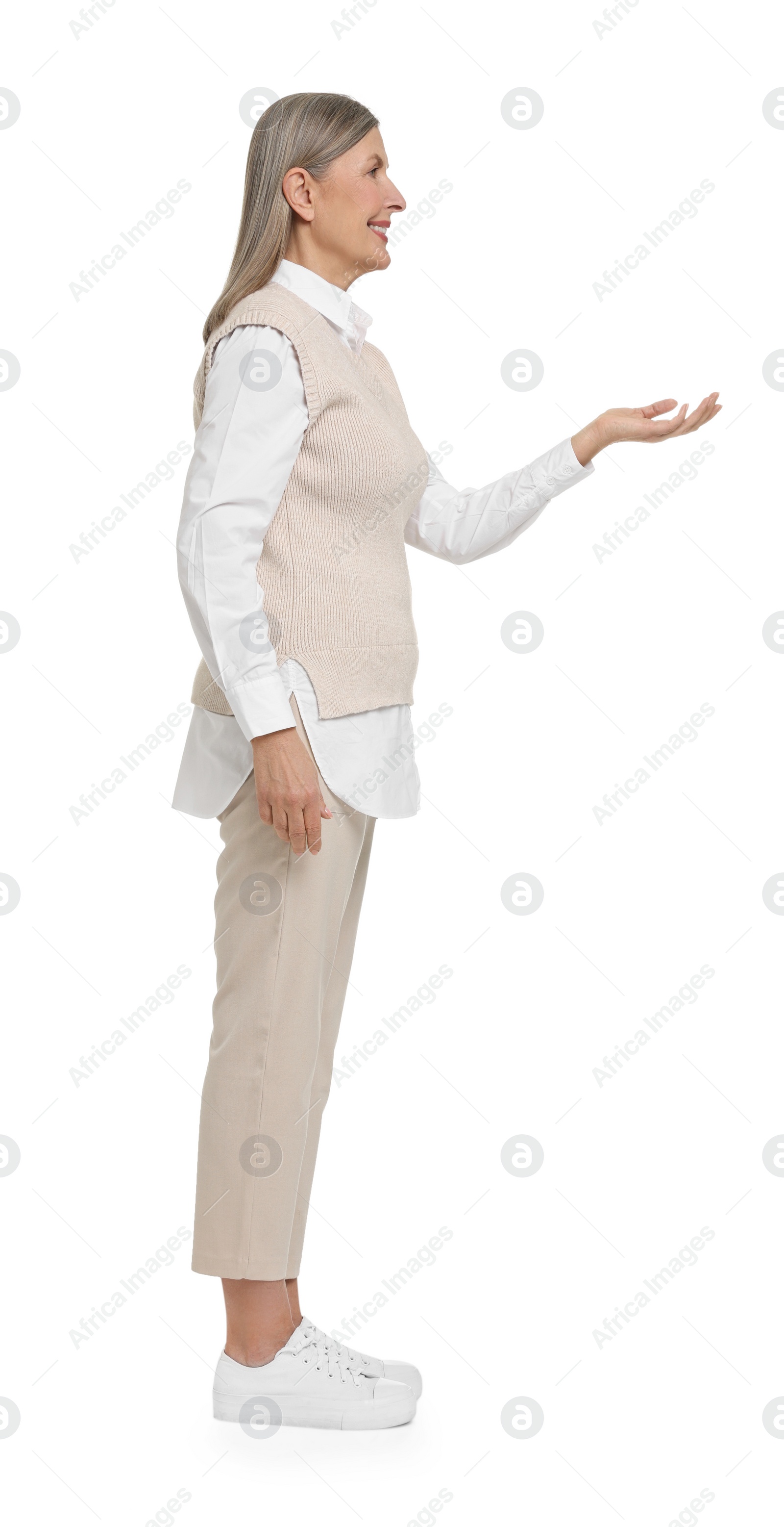 Photo of Full length portrait of senior woman on white background