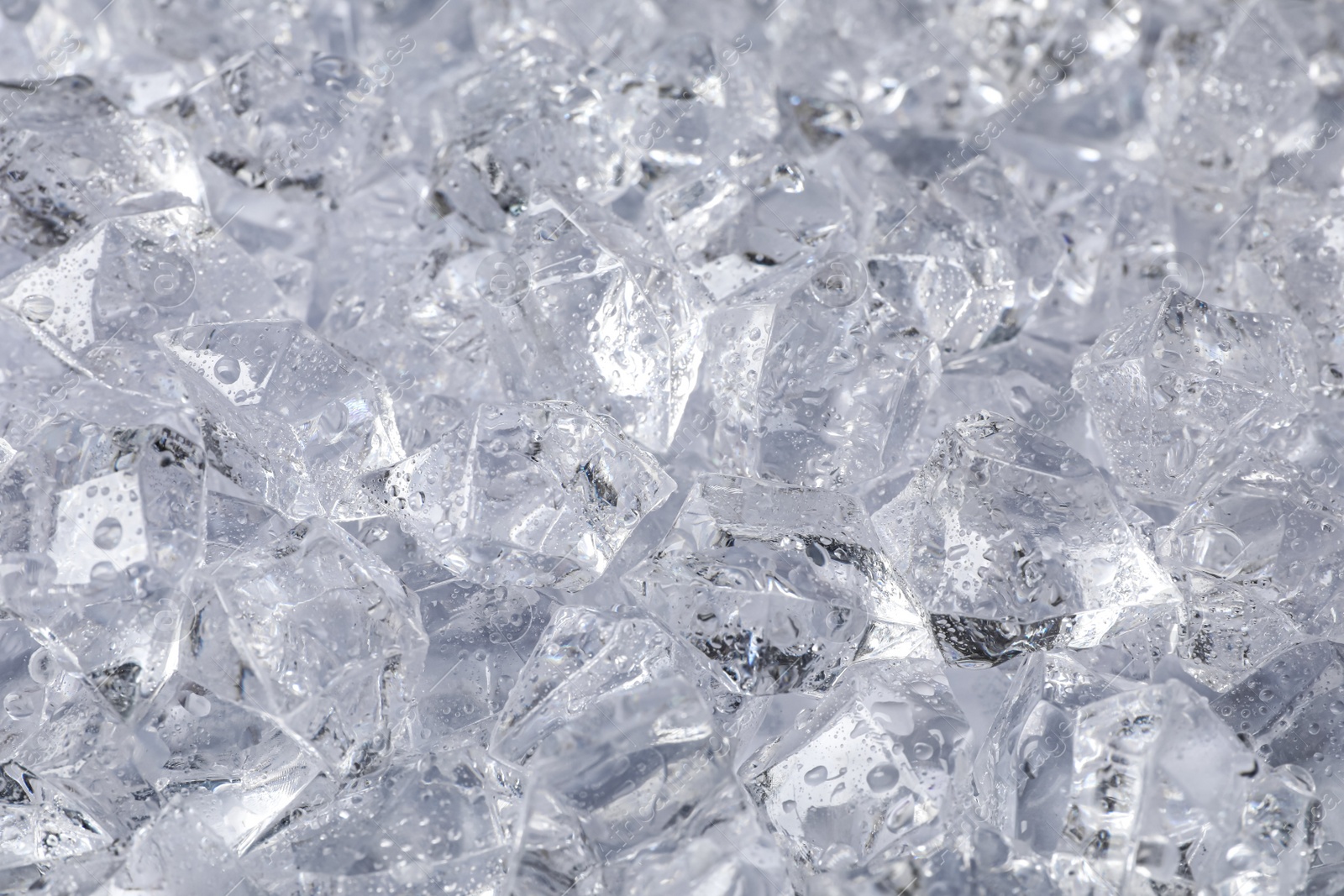 Photo of Clear crushed ice as background, closeup view