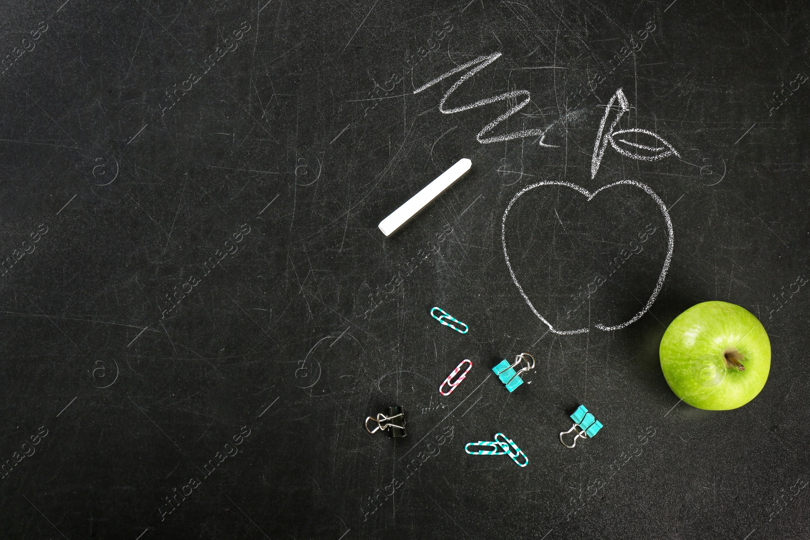 Photo of Flat lay composition for Teacher's day on chalkboard