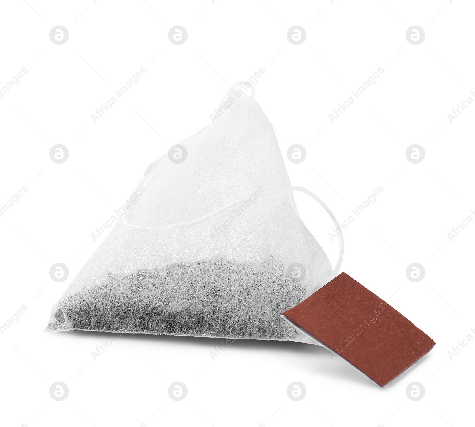 Photo of New tea bag with label on white background