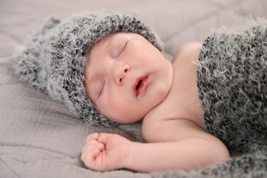 Photo of Cute newborn baby sleeping in bed, closeup