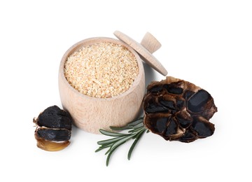 Dehydrated garlic granules, fermented black garlic and rosemary isolated on white