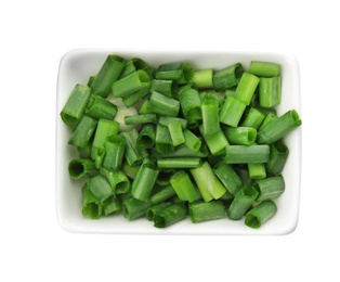 Bowl with chopped green onion on white background, top view