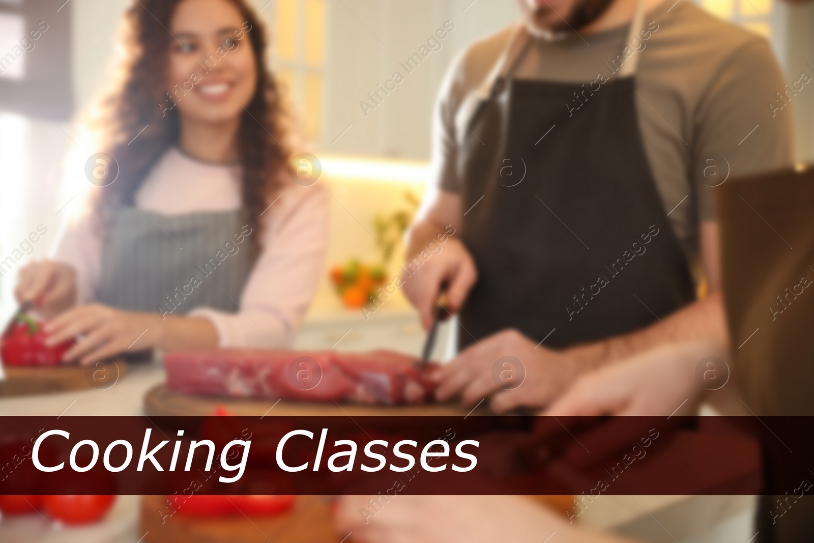 Image of Cooking classes. Blurred view of people cutting meat and vegetables in kitchen