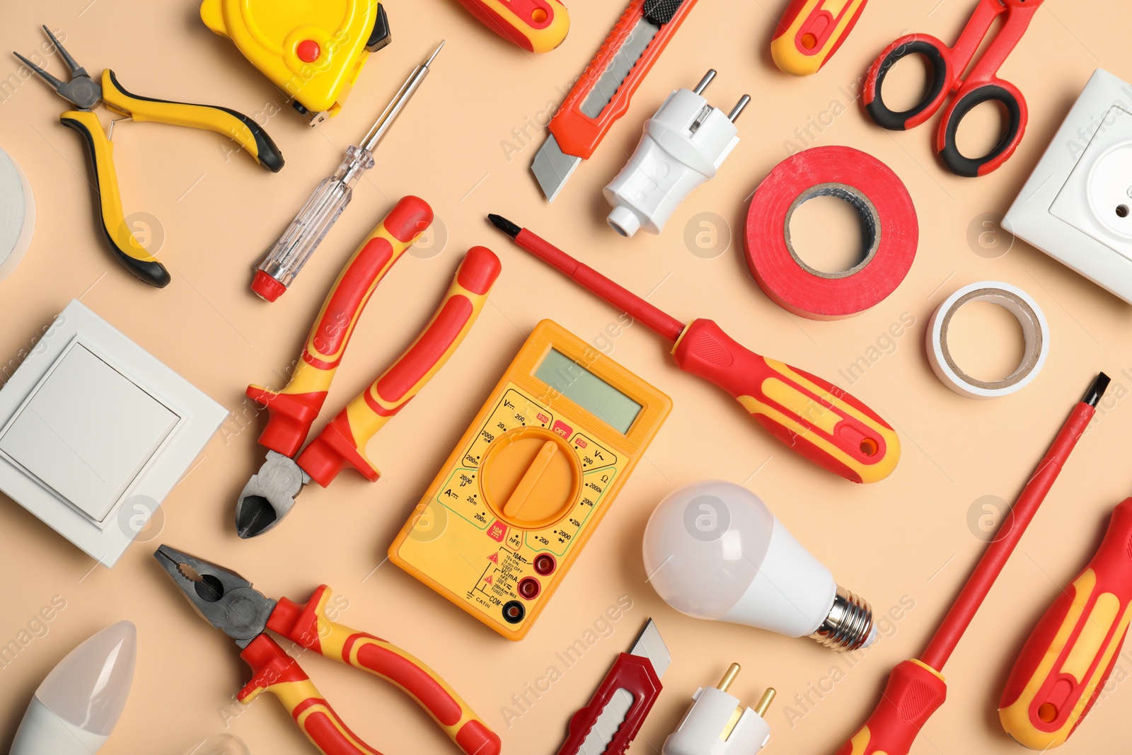 Photo of Flat lay composition with electrician's tools on color background