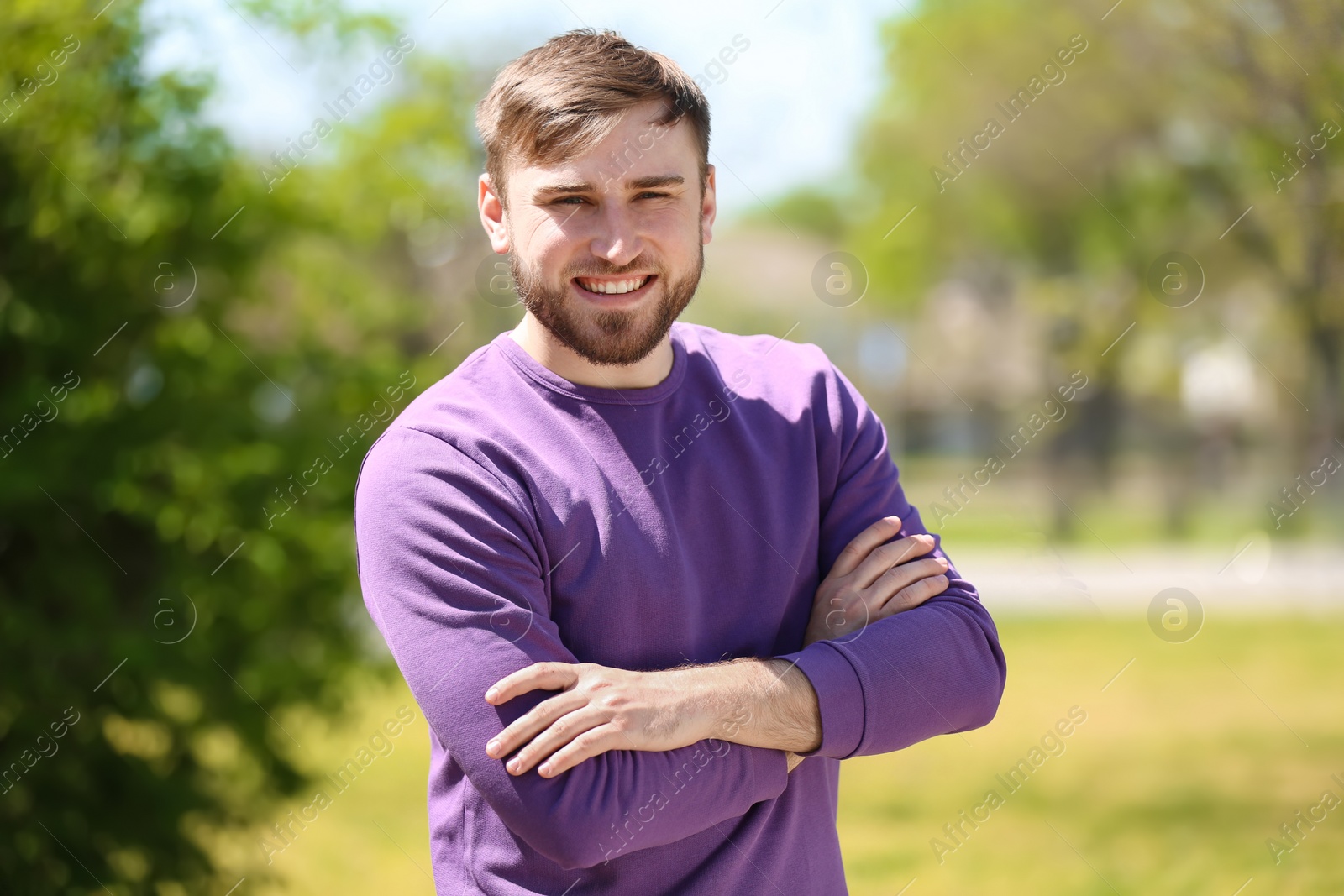 Photo of Portrait of young man in stylish outfit outdoors