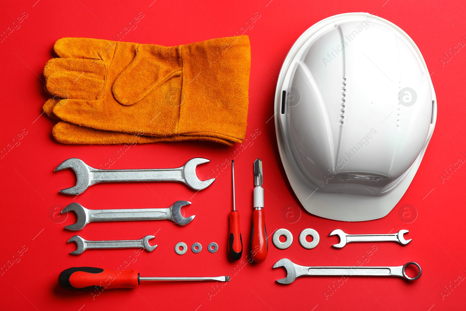 Photo of Flat lay composition with construction tools on color background