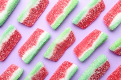 Tasty jelly candies on color background, flat lay