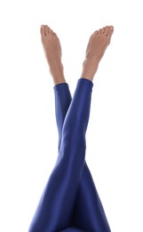 Photo of Woman with beautiful long legs wearing blue leggings on white background, closeup