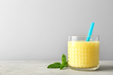 Photo of Glass with delicious detox smoothie on table