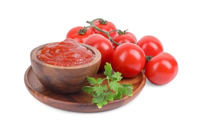 Photo of Organic ketchup in bowl, fresh tomatoes and parsley isolated on white. Tomato sauce