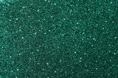 Image of Shiny dark green glitter as background, closeup