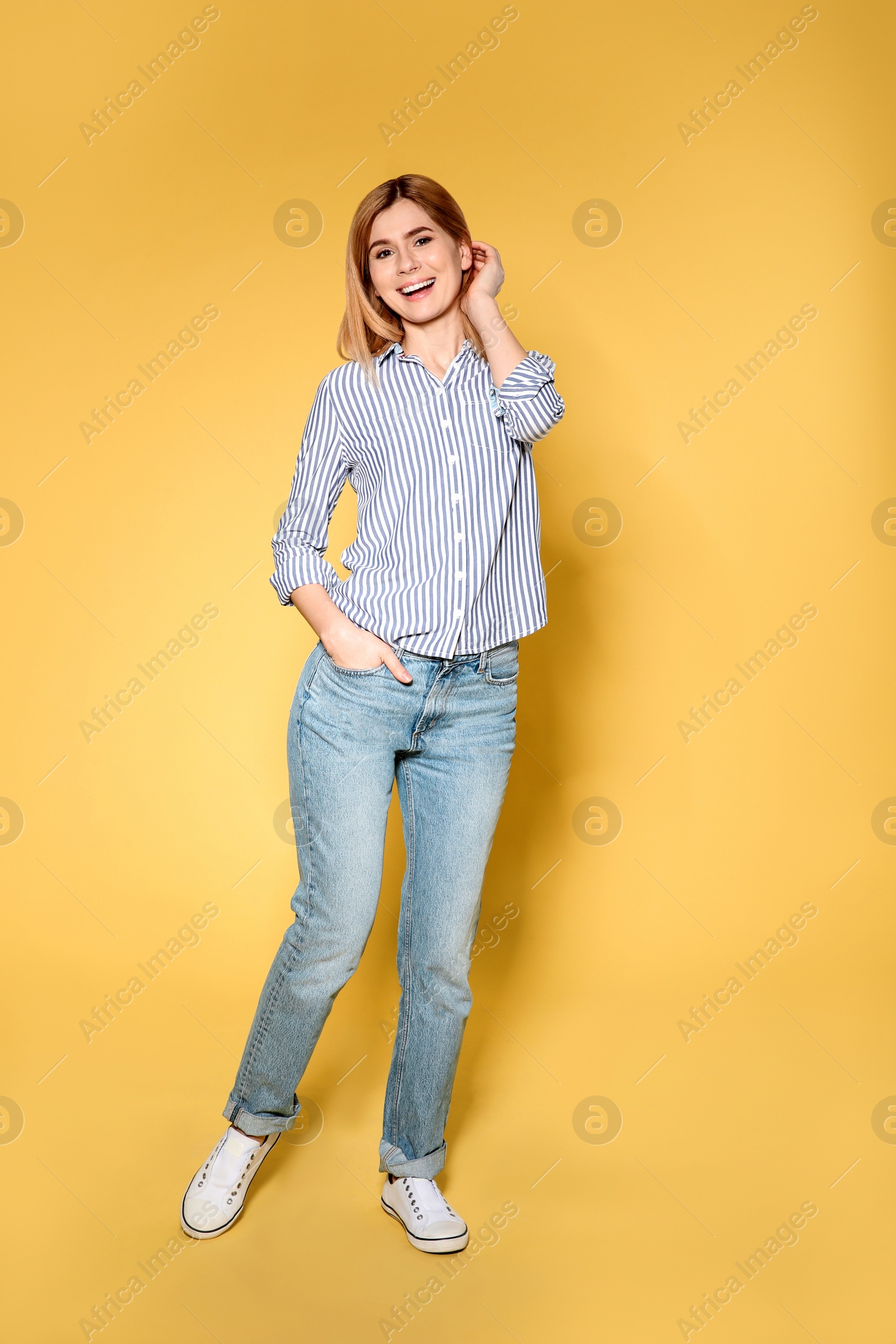 Photo of Full length portrait of beautiful woman on color background