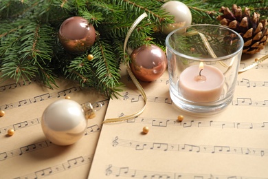 Photo of Composition with Christmas decorations on music sheets