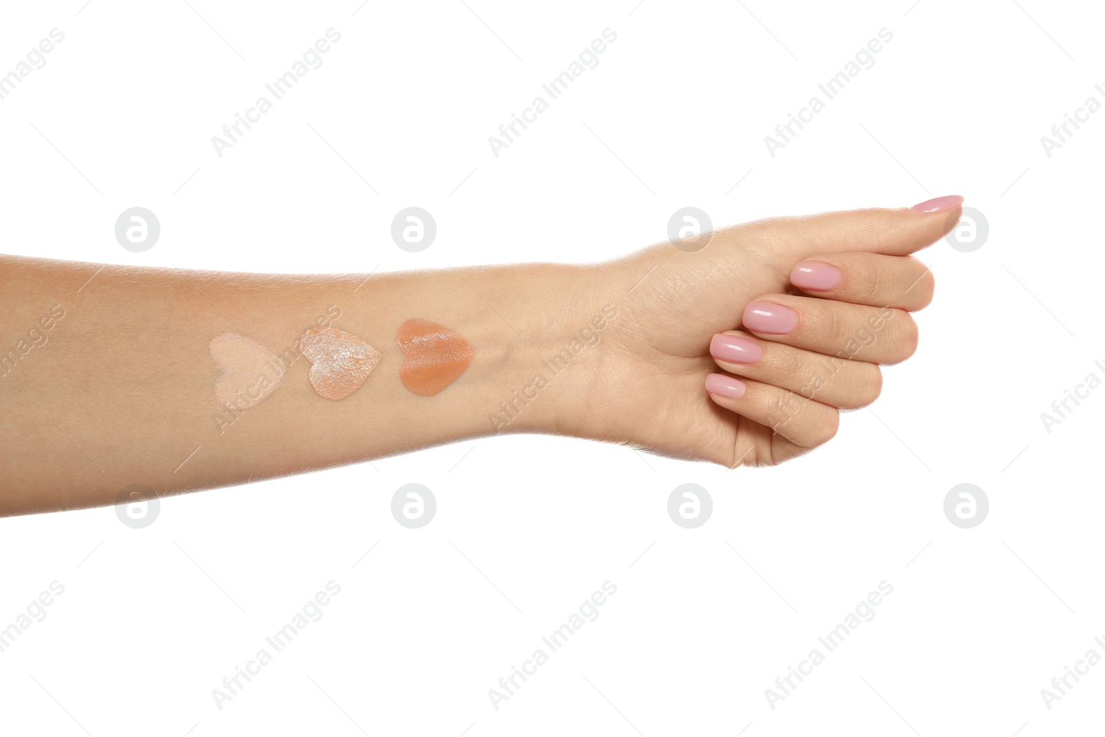 Photo of Woman with different foundation swatches on her hand against white background, closeup