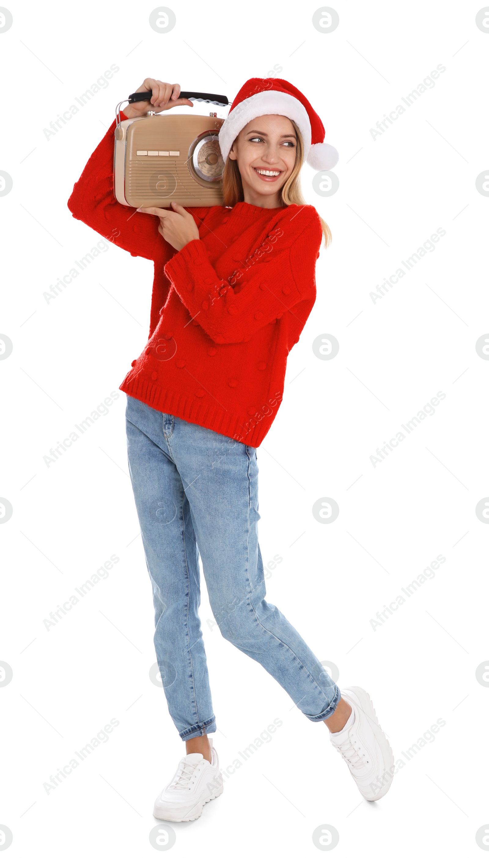 Photo of Happy woman with vintage radio on white background. Christmas music