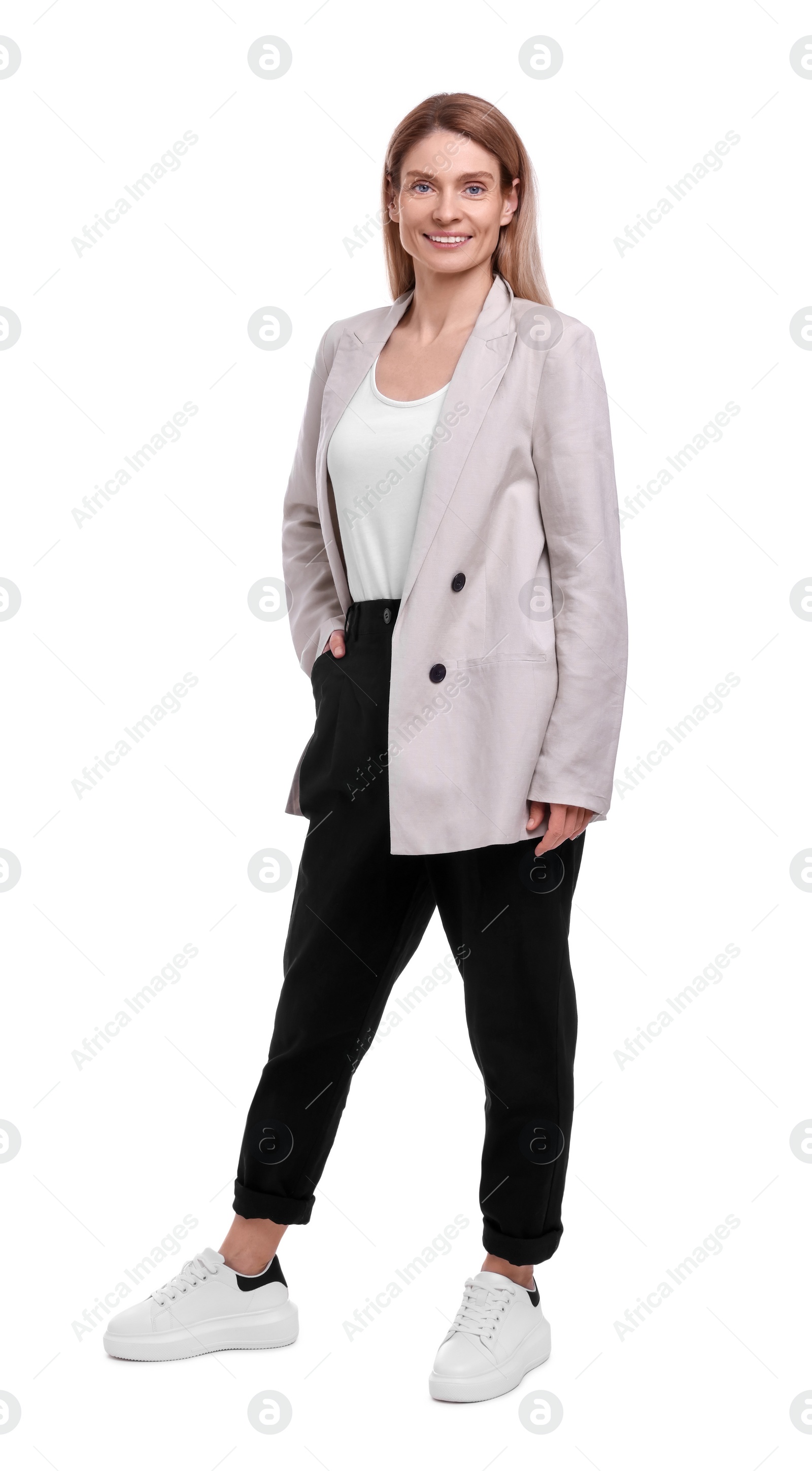 Photo of Beautiful happy businesswoman posing on white background