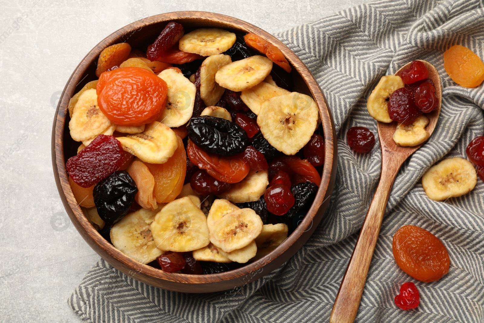 Photo of Mix of delicious dried fruits on table, flat lay