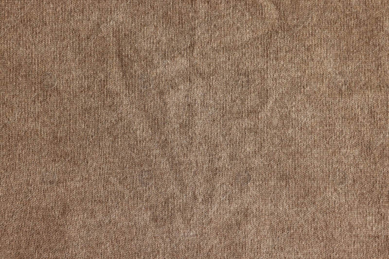 Photo of Beautiful light brown fabric as background, top view