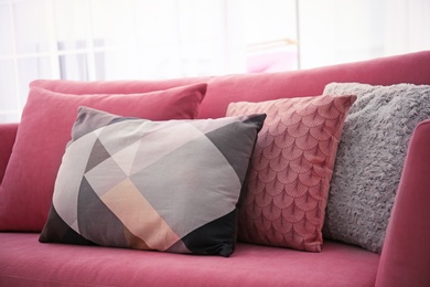 Photo of Sofa with colorful pillows in living room