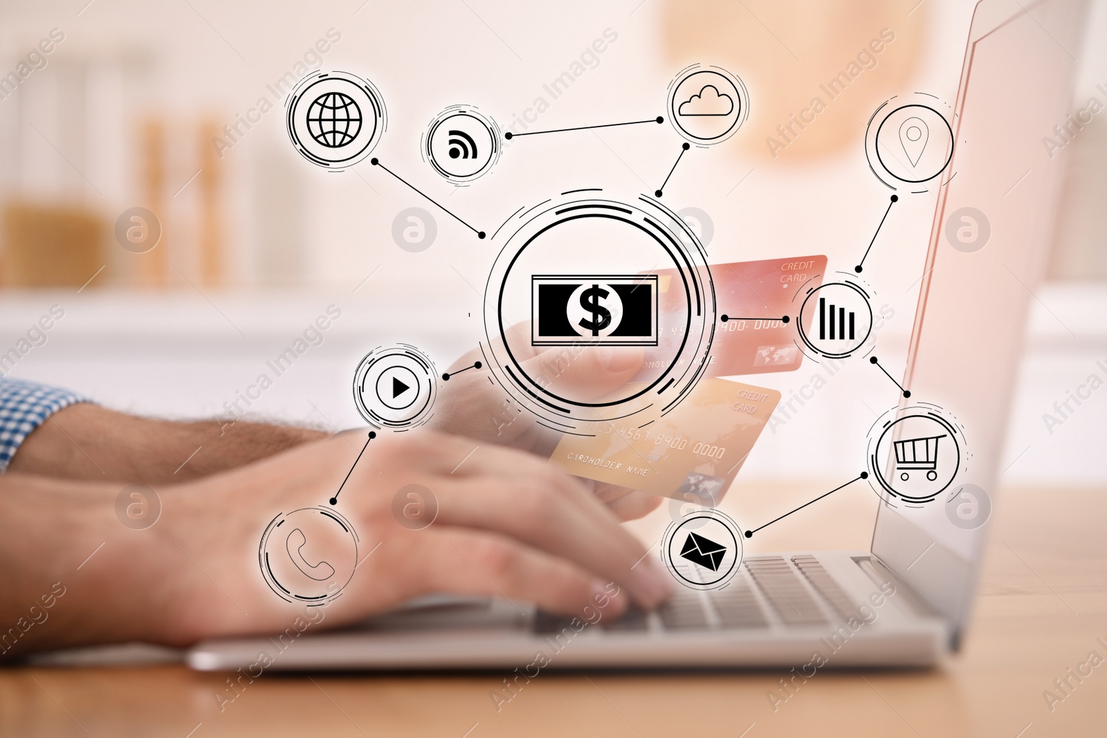 Image of Man using laptop and credit cards for online payment at table indoors , closeup