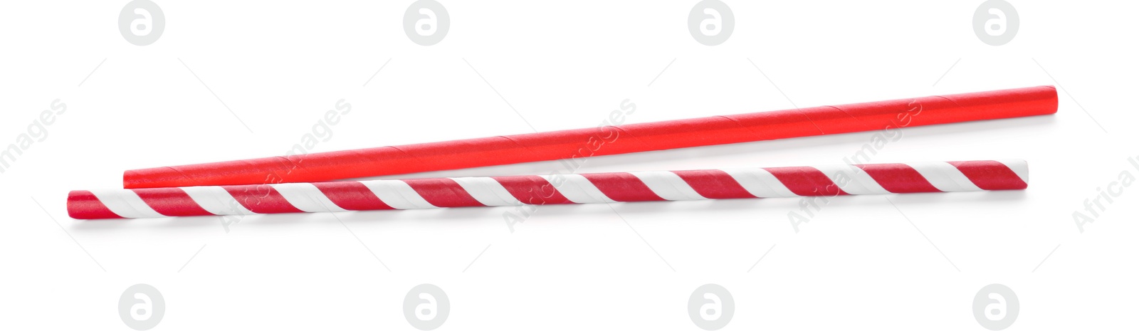 Photo of Different paper cocktail straws on white background