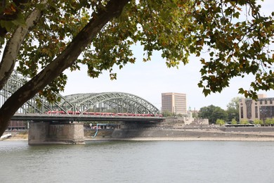 Photo of Cologne, Germany - August 28, 2022: Picturesque view of a modern bridge over river