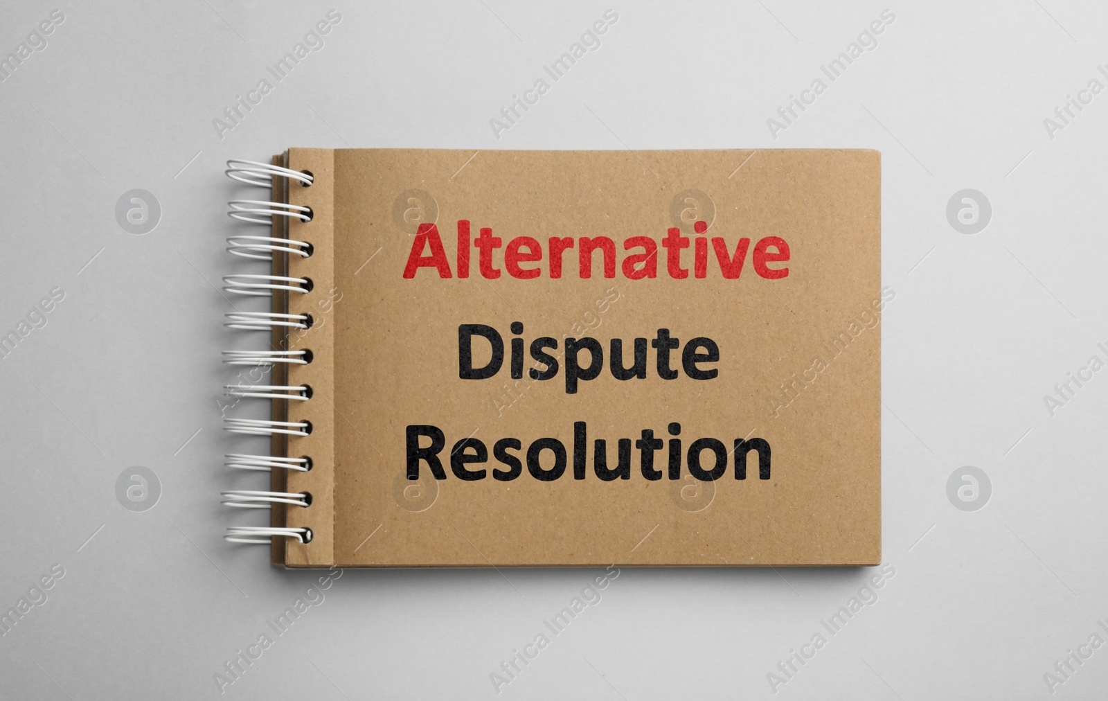 Image of Notebook with phrase Alternative Dispute Resolution on white background, top view