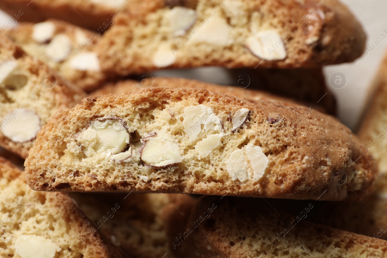 Photo of Tasty cantucci on table, closeup view. Traditional Italian almond biscuits